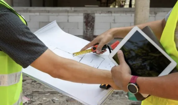 Building inspector using tablet during inspection