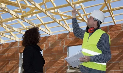 Inspector assessing home for building inspection